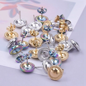 Macro detail of geometric 304 stainless steel earrings in gold, silver and rainbow finishes