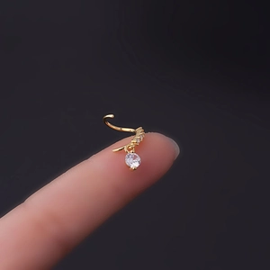 20G gold water drop zircon pendant nose ring piercing jewelry shown on fingertip