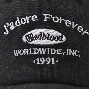 Washed black cotton baseball cap featuring vintage 1991 embroidery and round logo patch