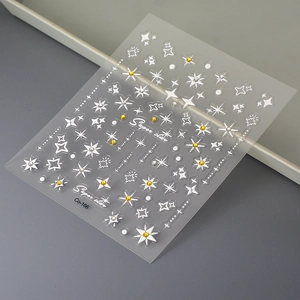 Starry nail art stickers featuring white and gold stars on a transparent background