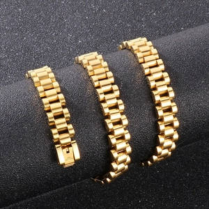 Detailed macro view of 10mm golden stainless steel watch band chain with engraved clasp