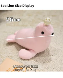 Detail view of pink soft seal plush toy measuring 25cm on a cream textured carpet