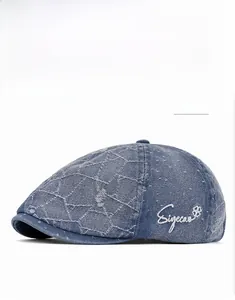 Deep blue denim flat cap with white clover and Siyecas lettering embroidery detail
