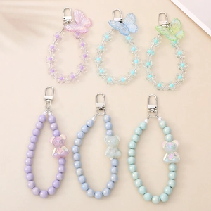 Colorful beaded keychains featuring glossy flower, butterfly, and bear charms set of six