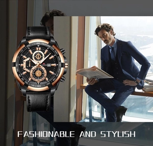 Detail of a men's racing watch with rose gold bezel and a blue business suit background