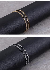 Detail of classic gold and silver figaro chains for men with metallic luster