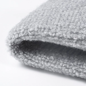 Thick light gray sherpa fleece knitted beanie with warm textured teddy fabric detail