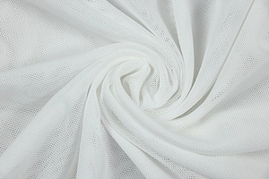 Macro detail of high-quality white mesh fabric showing fine texture and soft spiral folds