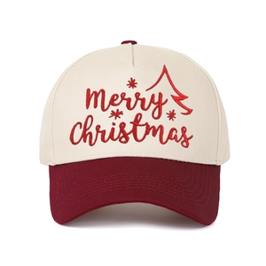 Close-up of Merry Christmas embroidery on a red and beige five-panel baseball cap
