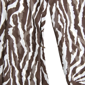Detail shot of brown zebra print fabric and hidden side zipper on a summer dress