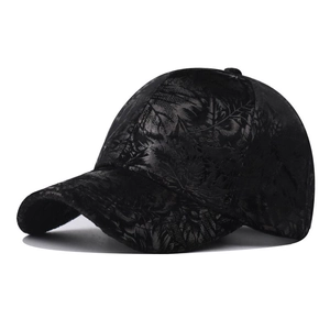 Close-up of the subtle leaf pattern on this black cotton baseball cap with curved brim