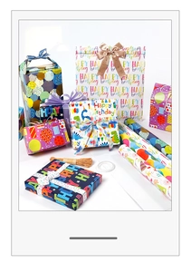 Detail view of colorful Happy Birthday gift wrap set with boxes, bags and ribbons