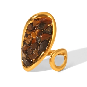 Macro view of French vintage gold ring featuring inlaid brown natural stone accents