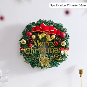 Christmas wreath with green pine needles, red bow and golden bells in 32cm diameter