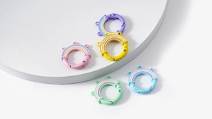 Close-up of colorful rainbow spring ring clasps in macaron shades for DIY keychains