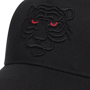 Black baseball cap featuring a detailed 3D tiger head embroidery with striking red eyes