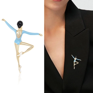 Elegant gold ballerina brooch with light blue enamel on black suit lapel