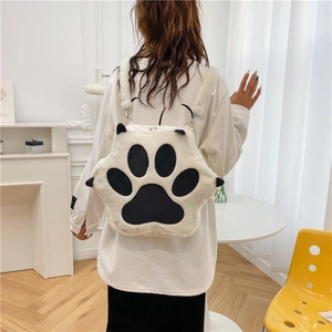 White plush cat paw backpack for women featuring cute 3D design and soft faux fur material