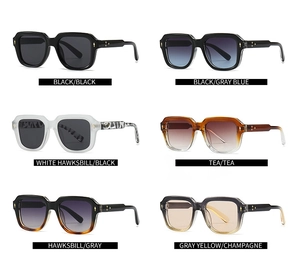 Detail view of square sunglasses in six assorted colors with metal rivet decorations