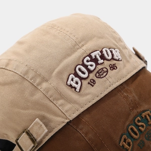 Detail of Boston 1985 embroidery on khaki cotton twill hat with vintage metal buckle