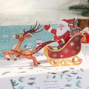 Biglietto di Natale 3D pop-up con Babbo Natale, renna e slitta in rosso e oro
