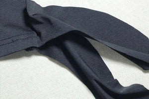 Close-up of black elastic fabric showing detailed texture and high-quality stitching