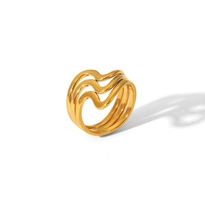 Detailed close-up of a golden layered wavy ring with polished stainless steel finish