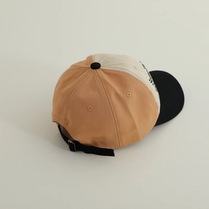 Rear view of three-color patchwork kids baseball cap with adjustable strap and metal buckle