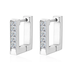 Macro detail of silver rectangle earrings featuring five square-cut cubic zirconia stones