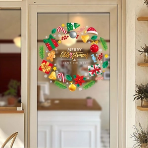 Christmas wreath window sticker featuring gingerbread man and gift box motifs on glass