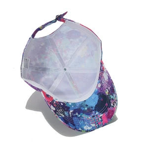 Detail of colorful graffiti baseball cap interior with 100% polyester fabric label