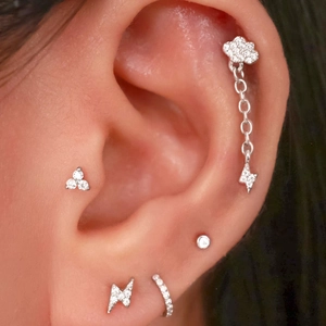 Detail shot of mini s925 silver cloud and lightning earrings with micro zircon inlays