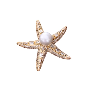Elegant 14K gold plated starfish brooch featuring central pearl and sparkling zircon stones