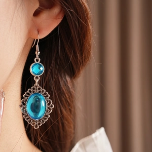Vintage bohemian drop earrings with blue resin stones and silver lace filigree detail