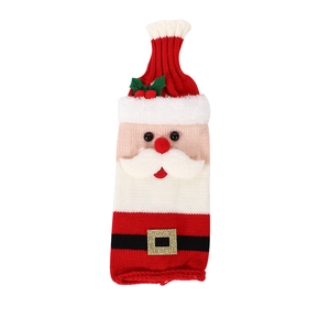 Knitted Santa Claus wine bottle cover with red hat and white beard for holiday decoration