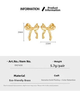 Detailed view of gold bow earrings showing 2.6cm x 2.2cm dimensions and brass texture