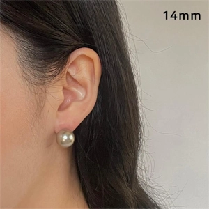 14mm silver grey pearl stud earring shown on model for size and scale reference