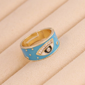 Detail of evil eye ring with blue enamel and sparkling zircon in beige velvet box