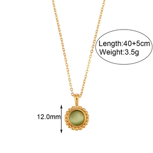 Detailed view of golden necklace with green gemstone pendant, 12mm diameter and 40cm chain