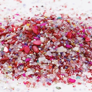 Macro detail of mixed 2-8mm irregular glass stones and beads for DIY nail art and crafts