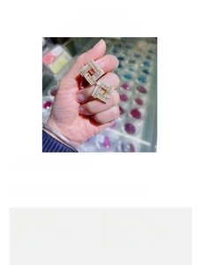 Detail view of geometric square pearl earrings with cubic zirconia and 2.4cm dimensions