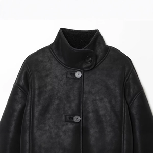 Chic black faux suede jacket with leather texture and soft plush lining detail