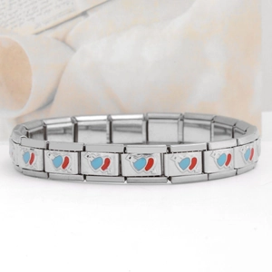 Detail of stainless steel modular link bracelet with blue and red enamel heart charms
