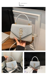 Detailed macro view of silver tassel decor and sequins on fashion leather handbag