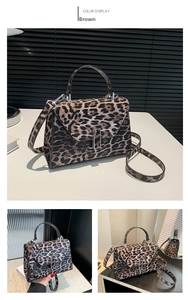 Detailed view of leopard print handbag with silver metal lock and PU leather texture