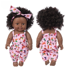 Front and back view of a 12-inch African American baby doll with curly hair and pink outfit