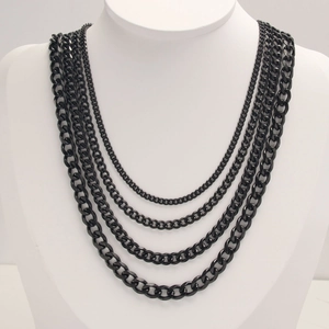 Men's hip hop black stainless steel multi-layered Cuban link necklace on a mannequin