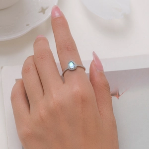 S925 sterling silver ring featuring a pear-cut moonstone with zircon pavé setting