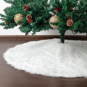 White long plush faux fur Christmas tree skirt on dark wood floor for holiday decor