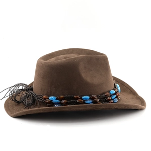 Detailed side view of brown suede cowboy hat featuring beaded band and black tassel decor